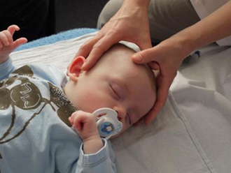 Ania treating a baby